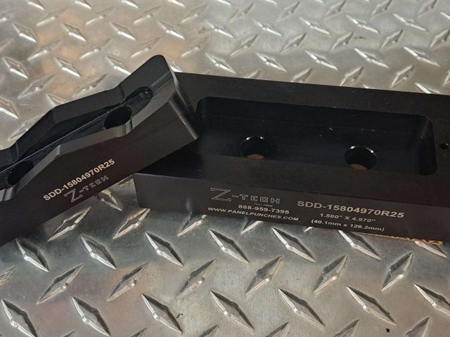 Custom SDD series die set 1.580" by 4.970"  with 0.250" radius corners.   Includes drill guide holes per spec.
