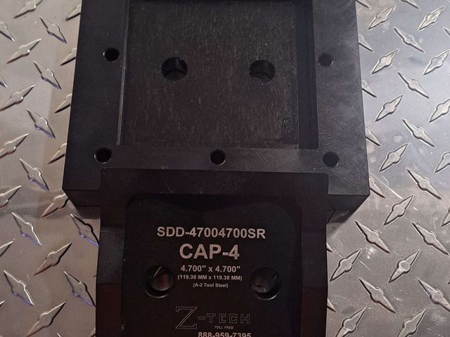 Custom Super Dandy BV Die Set, Opening 4.700" x 4.700" with 0.205 radius corners for IRISS CAP-4 Requires the BV-200 balanced drive system and two CYL-200D cylinders. Includes drill guides holes in die base for mounting holes.