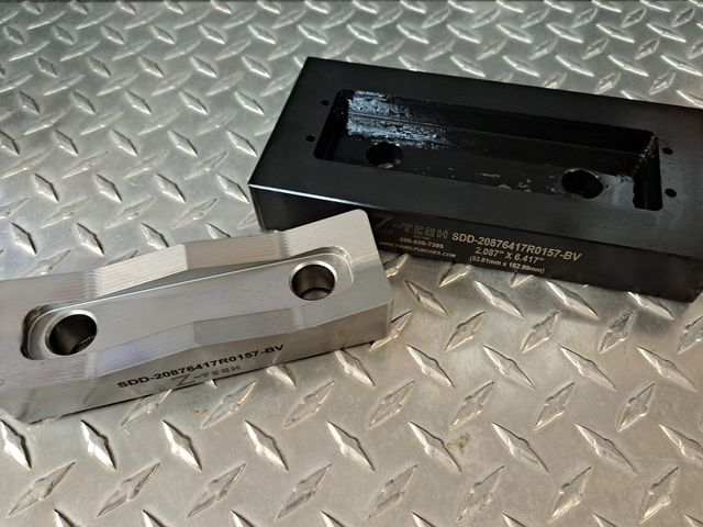 Custom Super Dandy Die Set 2.087" by 6.417" with 0.157R corners and revised to include drill guide holes per customer (Siemens) supplied documentation.  (Requires our BV-200-6 Balanced Drive System, Two (2) CYL-201 Draw Cylinders and a hydraulic power source for operation)